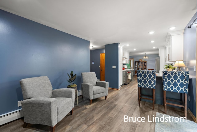 15520 157th Ave, Big Rapids, MI 49307 - living room with a baseboard radiator, wood finished floors, and recessed lighting