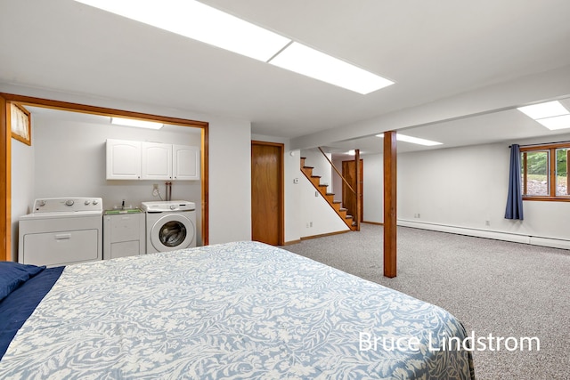 15520 157th Ave, Big Rapids, MI 49307 - bedroom featuring independent washer and dryer, a baseboard heating unit, and carpet flooring