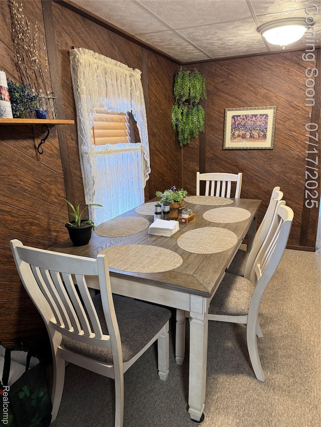 2185 Roslyn Ave, Flint, MI 48532 - carpeted dining area featuring wood walls