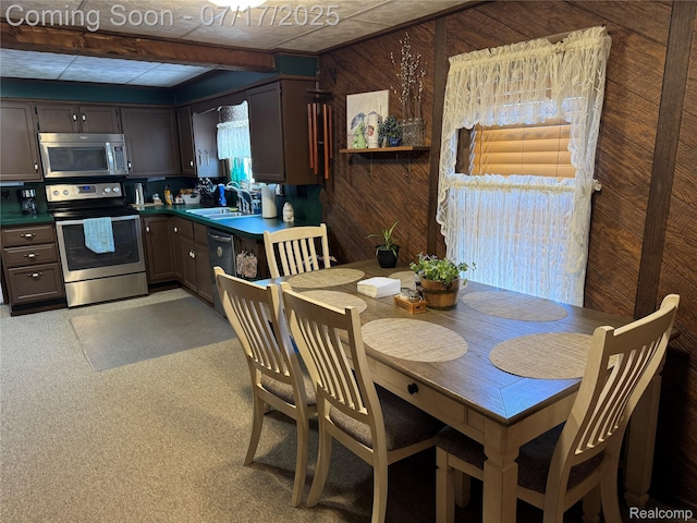 2185 Roslyn Ave, Flint, MI 48532 - dining space with wooden walls