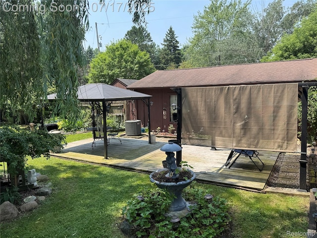 2185 Roslyn Ave, Flint, MI 48532 - rear view of property featuring a gazebo, a wooden deck, and a lawn
