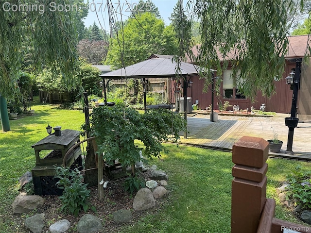 2185 Roslyn Ave, Flint, MI 48532 - view of grassy yard with a gazebo and a deck