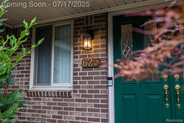625 Ten Point Dr, Rochester Hills, MI 48309 - property entrance with brick siding and covered porch