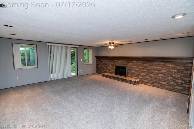625 Ten Point Dr, Rochester Hills, MI 48309 - unfurnished living room with a ceiling fan, a brick fireplace, a textured ceiling, carpet floors, and brick wall
