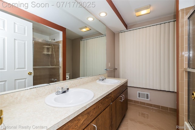 625 Ten Point Dr, Rochester Hills, MI 48309 - full bathroom featuring double vanity, a shower with door, and tile patterned floors