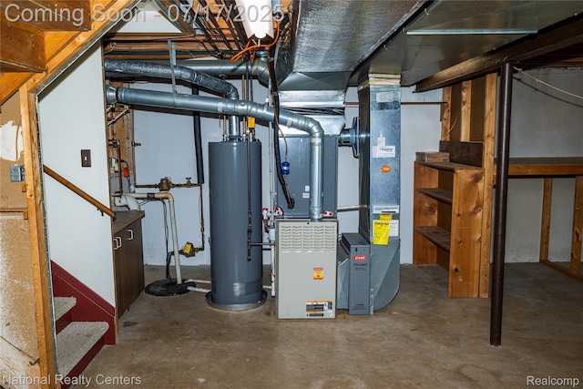 625 Ten Point Dr, Rochester Hills, MI 48309 - utility room featuring water heater, drainage system, and heating unit