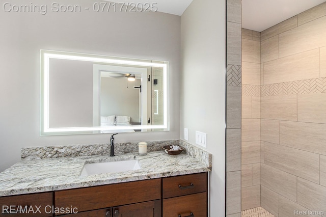 7171 Lucy Dr, Dexter, MI 48130 - full bathroom with vanity, a ceiling fan, and a tile shower