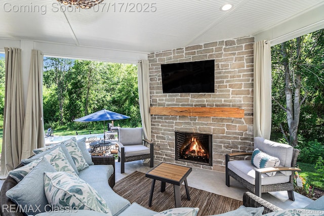 7171 Lucy Dr, Dexter, MI 48130 - view of patio / terrace with an outdoor living space with a fireplace