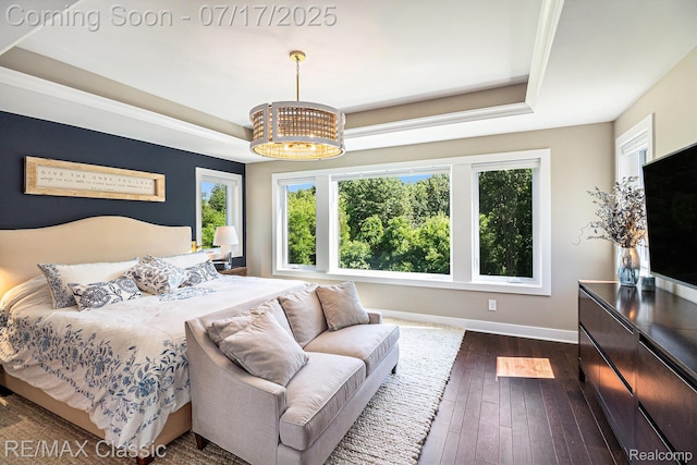 7171 Lucy Dr, Dexter, MI 48130 - bedroom featuring a tray ceiling, a chandelier, and dark wood-style floors