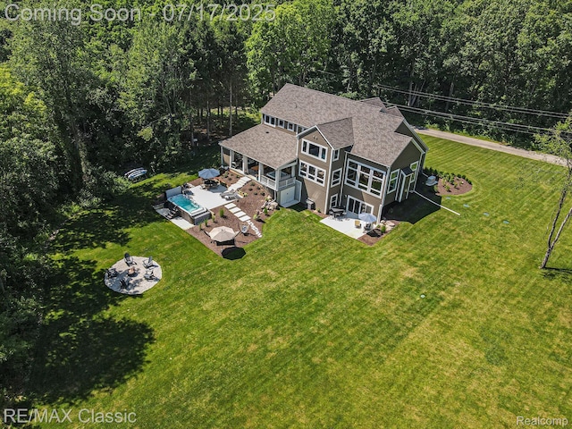 7171 Lucy Dr, Dexter, MI 48130 - view from above of property with a heavily wooded area
