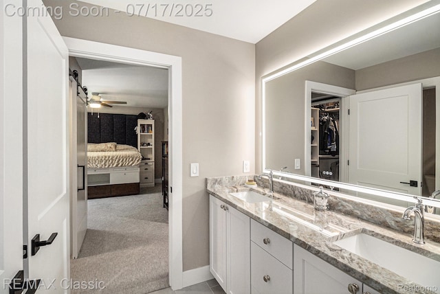 7171 Lucy Dr, Dexter, MI 48130 - full bath featuring ensuite bathroom, double vanity, a ceiling fan, and a spacious closet