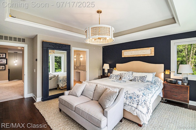 7171 Lucy Dr, Dexter, MI 48130 - bedroom featuring a tray ceiling, wood-type flooring, and multiple windows