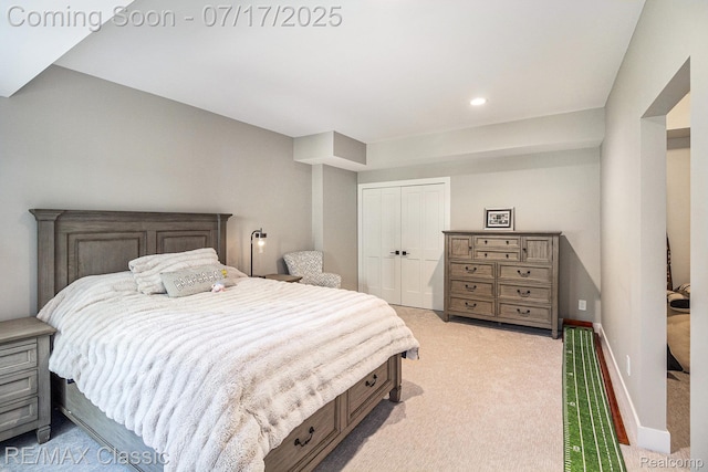 7171 Lucy Dr, Dexter, MI 48130 - bedroom with light colored carpet, a closet, and recessed lighting