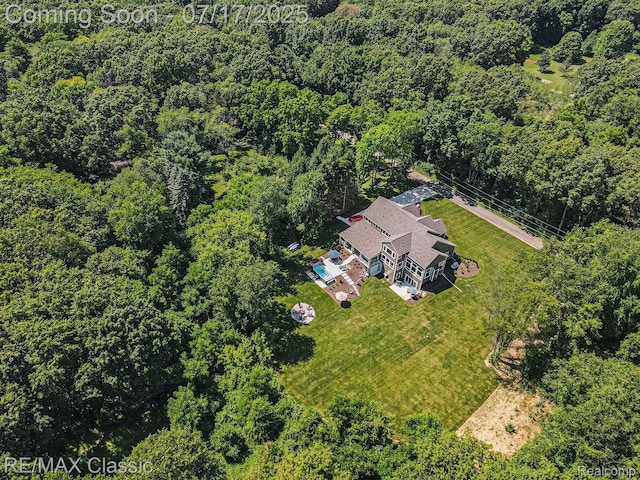 7171 Lucy Dr, Dexter, MI 48130 - aerial view of property and surrounding area with a heavily wooded area