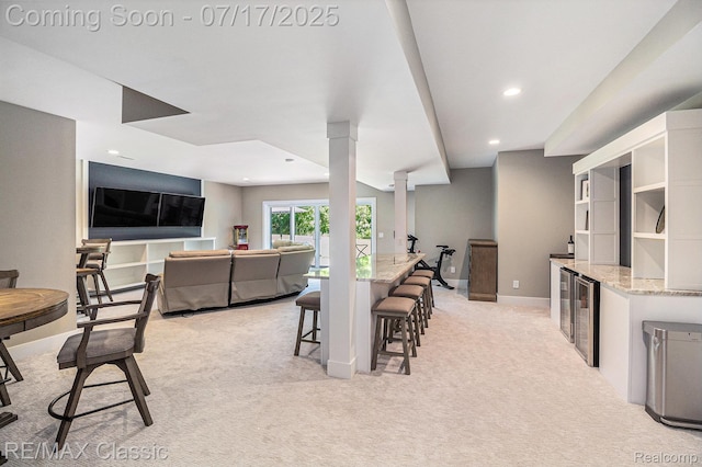 7171 Lucy Dr, Dexter, MI 48130 - dining space with light colored carpet, recessed lighting, beverage cooler, and bar