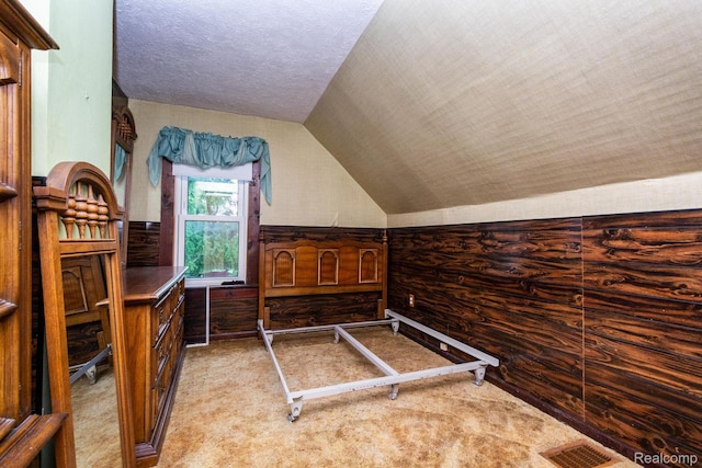 19817 Martin Rd, Saint Clair Shores, MI 48081 - bedroom featuring vaulted ceiling, carpet, and a textured ceiling