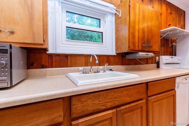 19817 Martin Rd, Saint Clair Shores, MI 48081 - kitchen with light countertops, stainless steel microwave, and brown cabinetry