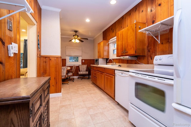 19817 Martin Rd, Saint Clair Shores, MI 48081 - kitchen with white appliances, crown molding, brown cabinetry, ceiling fan, and a wainscoted wall