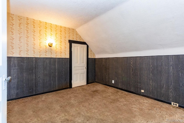 19817 Martin Rd, Saint Clair Shores, MI 48081 - additional living space with wallpapered walls, wainscoting, lofted ceiling, and carpet floors