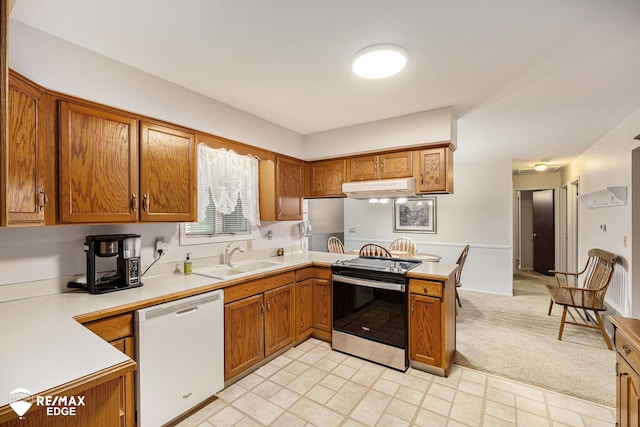 8208 E Potter Rd, Davison, MI 48423 - kitchen with dishwasher, stainless steel electric range, under cabinet range hood, a peninsula, and brown cabinetry