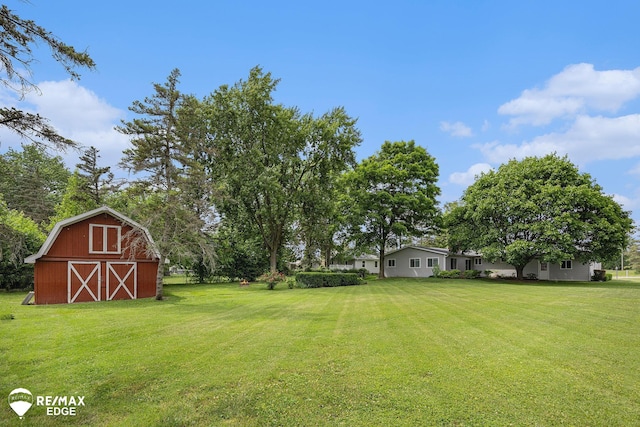 8208 E Potter Rd, Davison, MI 48423 - view of grassy yard with a barn and an outbuilding