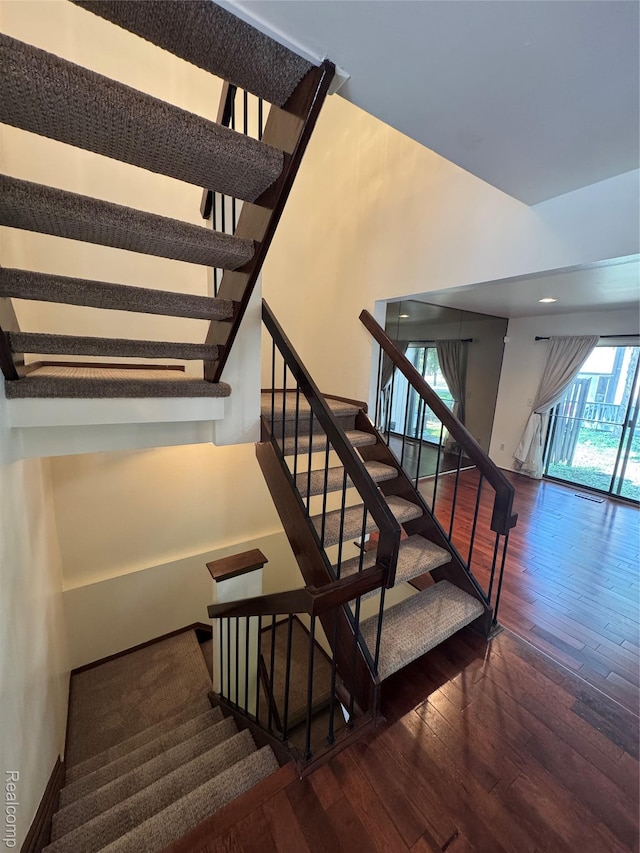 5216 Brett Ct, West Bloomfield, MI 48322 - staircase featuring hardwood / wood-style floors