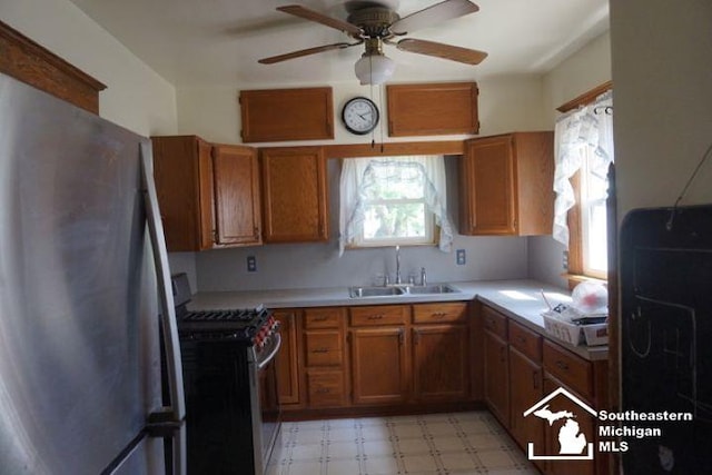 611 Hubble, Monroe, MI 48161 - kitchen featuring appliances with stainless steel finishes, brown cabinets, and plenty of natural light