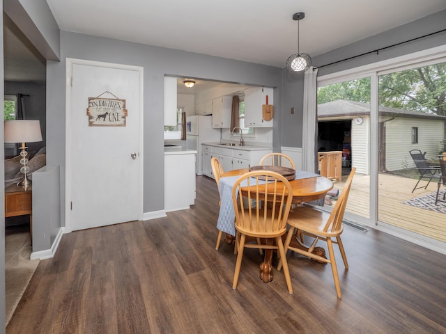 3130 27th St SW, Grandville, MI 49418 - dining space featuring dark wood-style floors and healthy amount of natural light