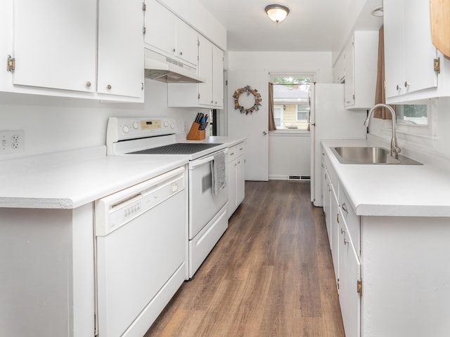 3130 27th St SW, Grandville, MI 49418 - kitchen featuring under cabinet range hood, white appliances, dark wood-style floors, white cabinets, and light countertops