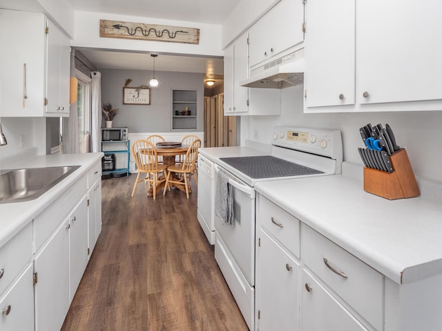 3130 27th St SW, Grandville, MI 49418 - kitchen featuring under cabinet range hood, white appliances, white cabinets, dark wood-type flooring, and light countertops