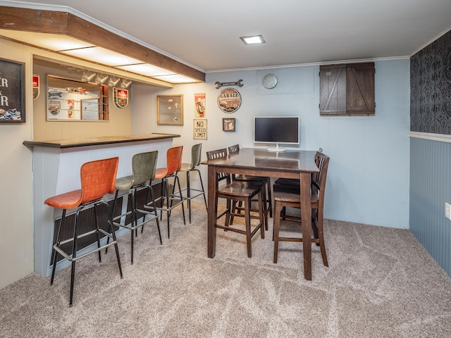 3130 27th St SW, Grandville, MI 49418 - dining room featuring a dry bar, carpet flooring, and ornamental molding