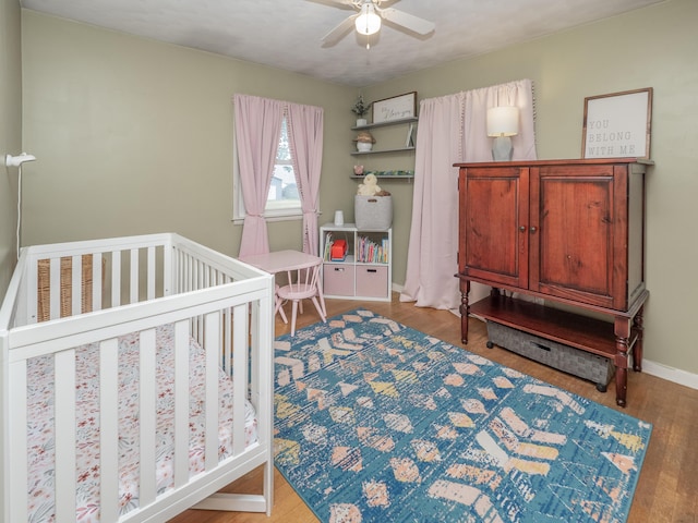 3130 27th St SW, Grandville, MI 49418 - bedroom with wood finished floors and a ceiling fan