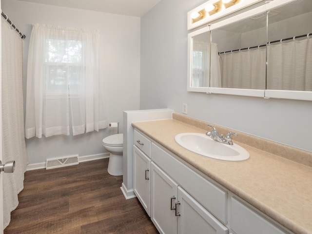 3130 27th St SW, Grandville, MI 49418 - bathroom featuring vanity and wood finished floors