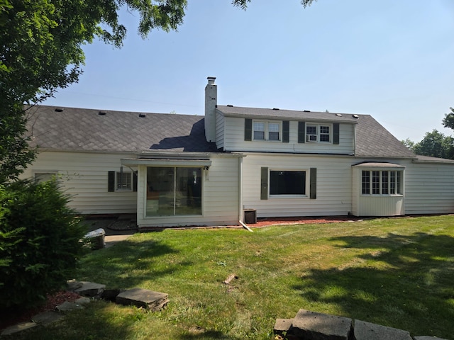 1115 W Maumee St, Adrian, MI 49221 - rear view of house featuring a yard and a chimney