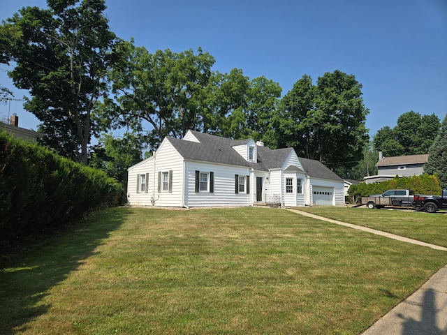 1115 W Maumee St, Adrian, MI 49221 - new england style home with a front yard, a garage, and a shingled roof
