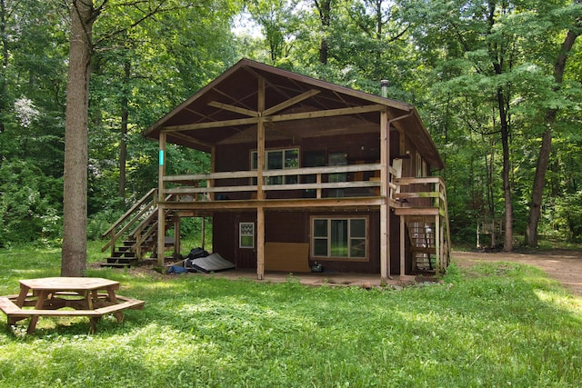 23627 Glenwood Rd, Cassopolis, MI 49031 - rear view of house with stairway, a wooden deck, a patio area, and a lawn