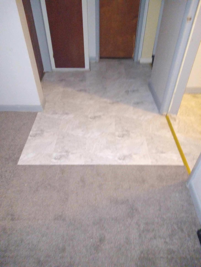 hallway with carpet floors
