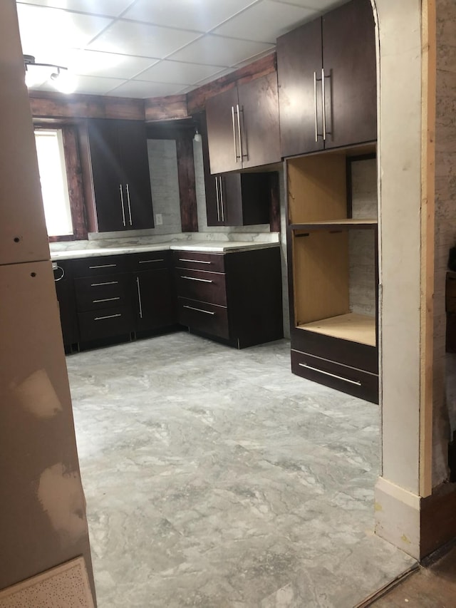 kitchen featuring concrete flooring and light countertops