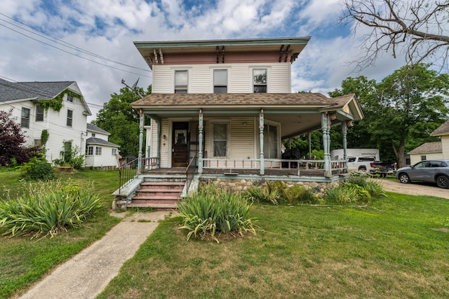 italianate home with a porch and a front lawn