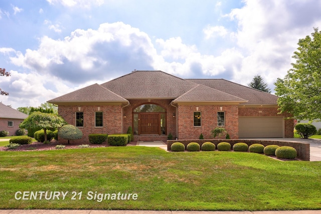 43 Sawmill Creek Trl, Saginaw, MI 48603 - view of front facade featuring brick siding, a front lawn, a garage, a shingled roof, and concrete driveway
