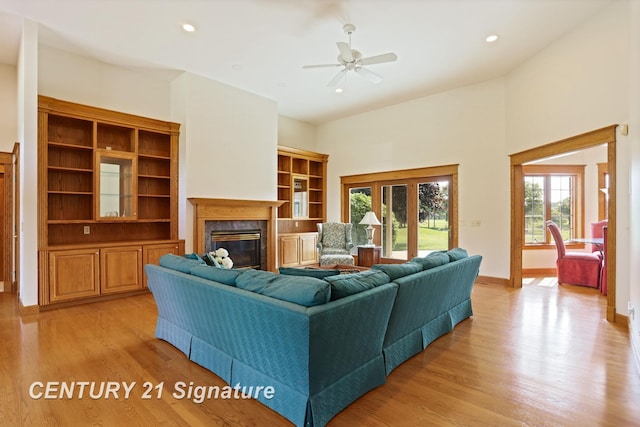 43 Sawmill Creek Trl, Saginaw, MI 48603 - living room featuring a fireplace, light wood-style floors, healthy amount of natural light, ceiling fan, and recessed lighting