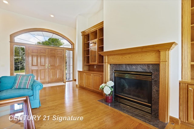43 Sawmill Creek Trl, Saginaw, MI 48603 - living room with light wood finished floors, a premium fireplace, and recessed lighting