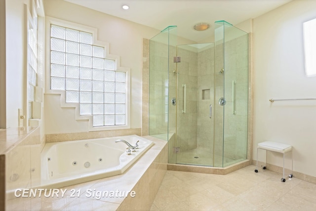 43 Sawmill Creek Trl, Saginaw, MI 48603 - full bath featuring a stall shower, a jetted tub, tile patterned floors, and healthy amount of natural light