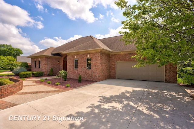 43 Sawmill Creek Trl, Saginaw, MI 48603 - ranch-style home featuring driveway, an attached garage, brick siding, and a shingled roof