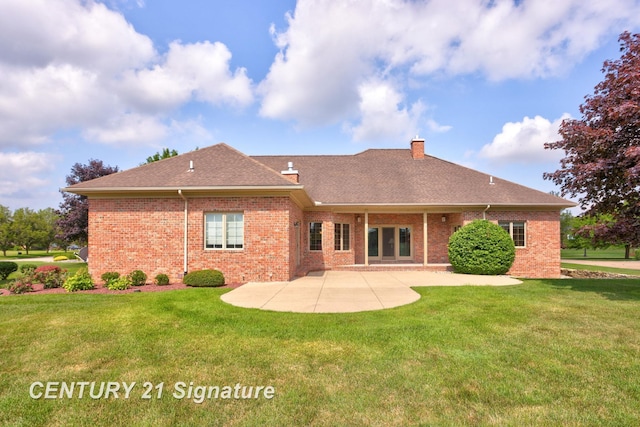 43 Sawmill Creek Trl, Saginaw, MI 48603 - back of property featuring a patio, brick siding, a chimney, and a yard