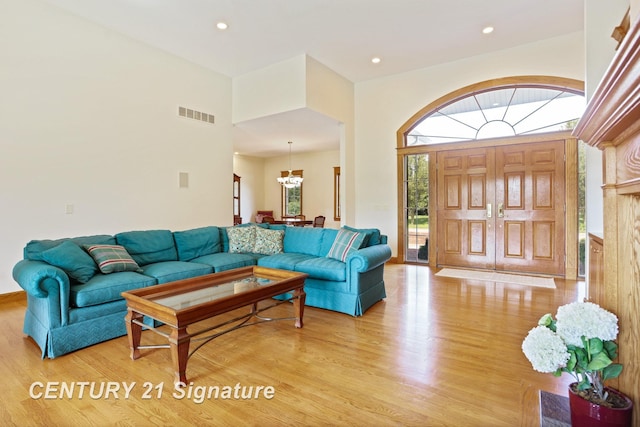 43 Sawmill Creek Trl, Saginaw, MI 48603 - living area with light wood-style floors, a chandelier, and recessed lighting