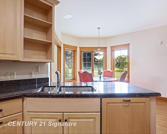43 Sawmill Creek Trl, Saginaw, MI 48603 - kitchen with light brown cabinetry, dark stone counters, hanging light fixtures, and open shelves