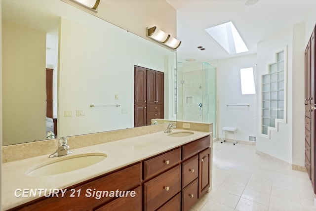 43 Sawmill Creek Trl, Saginaw, MI 48603 - bathroom featuring a skylight, double vanity, an enclosed shower, and tile patterned flooring