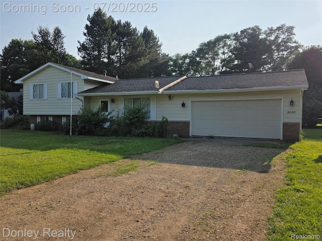 6059 Windward St, North Branch, MI 48461 - split level home with gravel driveway, a front yard, brick siding, and a garage