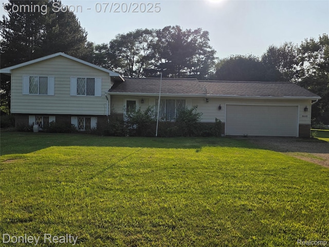 6059 Windward St, North Branch, MI 48461 - tri-level home featuring a garage, a front yard, driveway, and brick siding